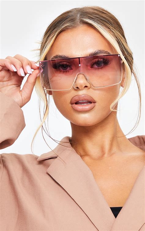 clear sunglasses with pink lenses.